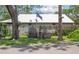 A whimsical backyard featuring a wooden pirate ship play structure, nestled among mature trees at 4949 Lake Kotsa Dr, Lake Wales, FL 33898