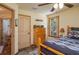 Cozy bedroom boasting a wood-look floor, window, and warm, inviting tones at 4949 Lake Kotsa Dr, Lake Wales, FL 33898