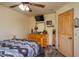 Charming bedroom features wood accents and a cozy aesthetic with unique decor at 4949 Lake Kotsa Dr, Lake Wales, FL 33898