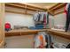 Walk-in closet featuring wood trim and shelving with a variety of hanging and folded clothes at 4949 Lake Kotsa Dr, Lake Wales, FL 33898