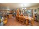 Open concept dining room and kitchen showcases the wood table and island with seating at 4949 Lake Kotsa Dr, Lake Wales, FL 33898