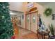 Welcoming foyer with decorative doors, staircase, and elegant decor at 4949 Lake Kotsa Dr, Lake Wales, FL 33898