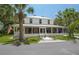 Inviting two-story home with a charming front porch and well-maintained landscaping at 4949 Lake Kotsa Dr, Lake Wales, FL 33898