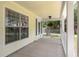 Covered front porch featuring classic architectural details and ample space for seating at 4949 Lake Kotsa Dr, Lake Wales, FL 33898