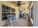 Inviting front porch with ample seating, providing a comfortable outdoor living space at 4949 Lake Kotsa Dr, Lake Wales, FL 33898