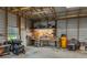 Spacious garage interior with a workbench, tools, and equipment, offering ample workspace at 4949 Lake Kotsa Dr, Lake Wales, FL 33898