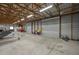 A well-lit garage showcasing ample space and potential for various storage and project needs at 4949 Lake Kotsa Dr, Lake Wales, FL 33898