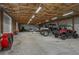 Large, well-lit garage interior with ample space for vehicle storage and other equipment at 4949 Lake Kotsa Dr, Lake Wales, FL 33898