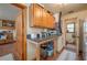 The laundry room features abundant counter space, overhead storage, and a utility sink at 4949 Lake Kotsa Dr, Lake Wales, FL 33898