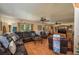 Comfortable living room features leather seating, natural light and open floor plan at 4949 Lake Kotsa Dr, Lake Wales, FL 33898