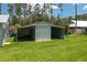 Outbuilding in a spacious yard, perfect for storage or a workshop, providing ample space at 4949 Lake Kotsa Dr, Lake Wales, FL 33898