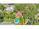Overhead view featuring the yard, above ground swimming pool, mature trees, and fenced-in back yard at 527 Duchess Dr, Lakeland, FL 33803