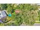 A view showing an above ground swimming pool, large trees, and close proximity to neighbors at 527 Duchess Dr, Lakeland, FL 33803