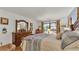 Bedroom featuring a large bed, hardwood floors, and wooden furniture at 527 Duchess Dr, Lakeland, FL 33803