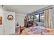 Cozy bedroom featuring a comfortable bed, plenty of natural light, and blue walls at 527 Duchess Dr, Lakeland, FL 33803