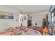 Bedroom featuring floral bedding, carpet floors, and white walls at 527 Duchess Dr, Lakeland, FL 33803