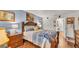 Bedroom featuring a bed, wooden furniture, decorations, and wood flooring at 527 Duchess Dr, Lakeland, FL 33803