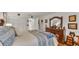 Bedroom featuring carpet, ceiling fan, decorations, dresser, and a bed at 527 Duchess Dr, Lakeland, FL 33803