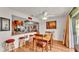 Cozy dining area adjacent to kitchen, featuring a wood table and ample natural light at 527 Duchess Dr, Lakeland, FL 33803