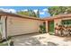 Close up of one-story home with an attached garage and landscaped front yard at 527 Duchess Dr, Lakeland, FL 33803