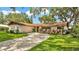 Charming single-story home with lush front lawn and inviting curb appeal at 527 Duchess Dr, Lakeland, FL 33803