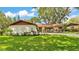 Attractive one-story home featuring a manicured lawn and well-maintained landscaping at 527 Duchess Dr, Lakeland, FL 33803