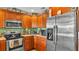 Beautiful kitchen featuring stainless steel appliances, updated cabinets, and stone countertops at 527 Duchess Dr, Lakeland, FL 33803