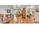 Bright living area featuring hardwood floors, an open layout, and access to the kitchen at 527 Duchess Dr, Lakeland, FL 33803