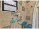Tiled shower with a built-in seat and handheld showerhead at 527 Duchess Dr, Lakeland, FL 33803