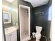 Bathroom with a tile shower and vanity, providing a clean and functional space at 550 E Thelma St, Lake Alfred, FL 33850