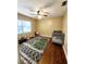 Bedroom featuring carpeted floors, ceiling fan, and a window for natural light, perfect for relaxation at 550 E Thelma St, Lake Alfred, FL 33850