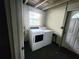Functional laundry room featuring a washer and dryer, providing convenient laundry facilities at 550 E Thelma St, Lake Alfred, FL 33850