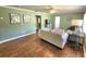 Cozy living room features fresh paint, wooden floors, ceiling fan, and comfortable seating for relaxation at 550 E Thelma St, Lake Alfred, FL 33850