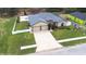 Aerial view of home showcasing the long brick driveway and large backyard at 607 S 16Th St, Haines City, FL 33844
