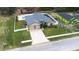 Aerial view of home showing backyard with pool, patio, and fencing at 607 S 16Th St, Haines City, FL 33844