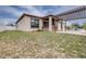 Outdoor kitchen with stone facade, pergola, and view of pool in backyard at 607 S 16Th St, Haines City, FL 33844