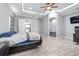 Spacious bedroom with ceiling fan and ensuite access to an office and kitchen at 607 S 16Th St, Haines City, FL 33844