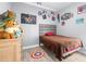 Well-lit bedroom featuring hardwood floors, art posters, and colorful posters at 607 S 16Th St, Haines City, FL 33844