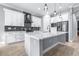 Modern kitchen featuring white cabinetry, mosaic backsplash, stainless steel appliances, and spacious countertops at 607 S 16Th St, Haines City, FL 33844