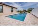 Backyard oasis with a sparkling in-ground pool and a spacious paver patio at 607 S 16Th St, Haines City, FL 33844