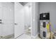 Utility room with water heater and toilet at 607 S 16Th St, Haines City, FL 33844