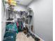 Organized walk-in closet with shelving, hanging rods, and space for shoes and luggage at 607 S 16Th St, Haines City, FL 33844