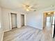 Spacious bedroom featuring wood-look floors, a ceiling fan, and a closet with open doors at 615 Ridge Ter # 615, Winter Haven, FL 33881