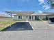 Charming single-story attached villa with carport parking and a well maintained lawn at 615 Ridge Ter # 615, Winter Haven, FL 33881