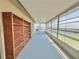 Enclosed lanai featuring a built-in bookshelf and large screened windows at 615 Ridge Ter # 615, Winter Haven, FL 33881
