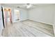Large primary bedroom boasting wood-look floors, a ceiling fan, closet and an en-suite bathroom at 615 Ridge Ter # 615, Winter Haven, FL 33881
