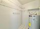 Storage room with shelving and a water heater at 615 Ridge Ter # 615, Winter Haven, FL 33881