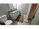 Bathroom featuring a double-sink vanity with granite countertop and white cabinets at 624 N Lanier Ave, Fort Meade, FL 33841