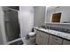 Bathroom featuring modern vanity with granite countertop and glass-enclosed shower at 624 N Lanier Ave, Fort Meade, FL 33841