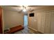 Bedroom with wood-look floors, closet, ceiling fan and good natural light at 624 N Lanier Ave, Fort Meade, FL 33841